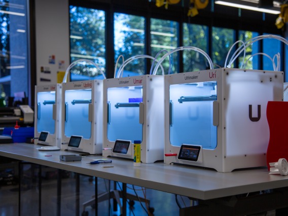 Several 3D printers on a table at CATalyst Studios