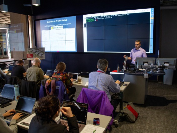 People listening to a lecture in the Data Studio
