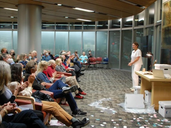Natalie Songer performing her show "Satellites" to a packed audience.