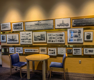 Photos on the wall of the USS Arizona Room in the Student Union