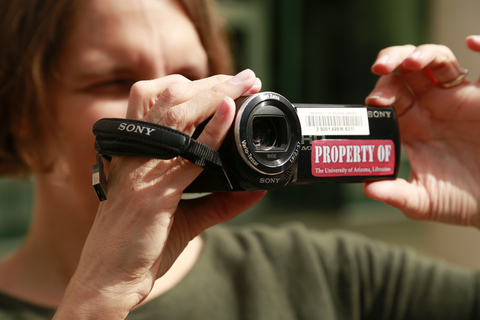 Photo of someone holding a video camera recorder