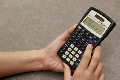 Photo of person using a scientific calculator